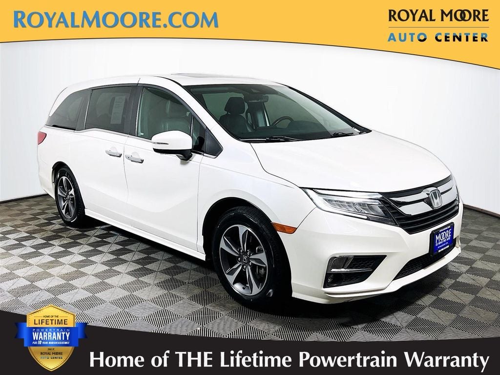 2018 Honda Odyssey Touring in White Diamond Pearl — front three-quarter view