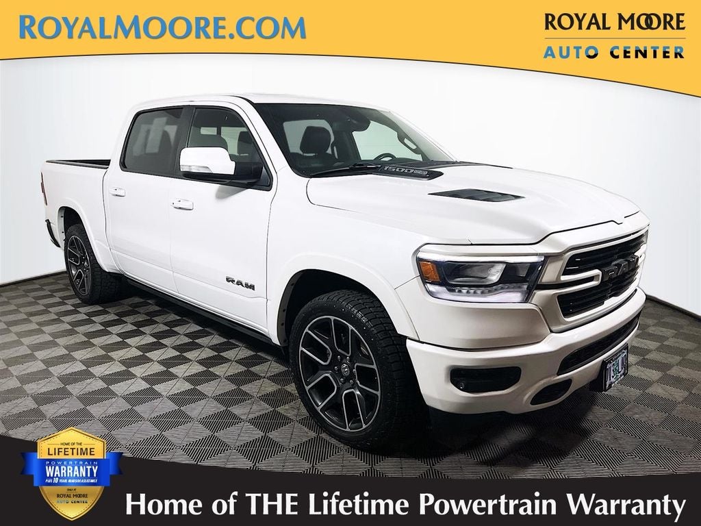 2019 RAM 1500 Laramie in Ivory White Tri-Coat Pearlcoat — front three-quarter view