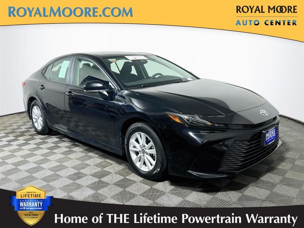2025 Toyota Camry LE in Midnight Black Metallic — front three-quarter view