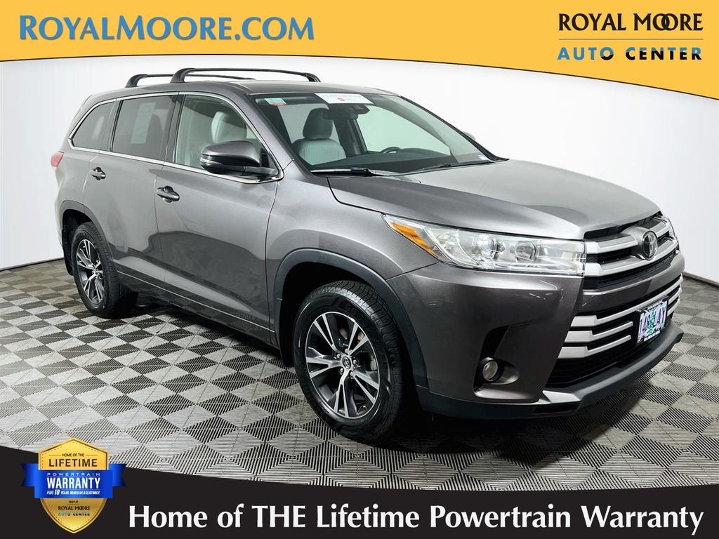 2018 Toyota Highlander LE Plus in Predawn Gray Mica — front three-quarter view